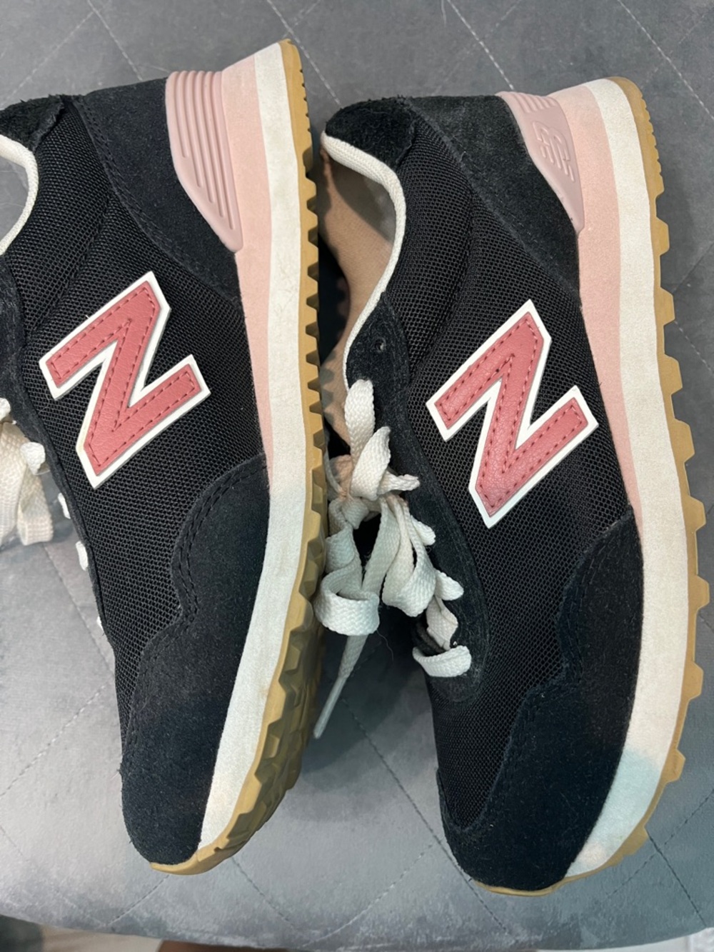New Balance Black Sneakers with Pink Accents and Gum Outsole